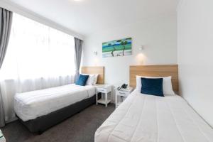 Postel nebo postele na pokoji v ubytování Aarangi Motel