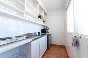 Kuchyň nebo kuchyňský kout v ubytování Aarangi Motel