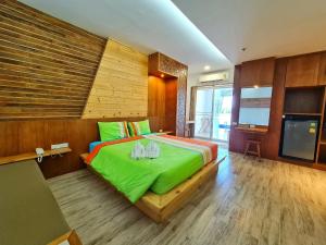 Postel nebo postele na pokoji v ubytování Tamnanpar Resort