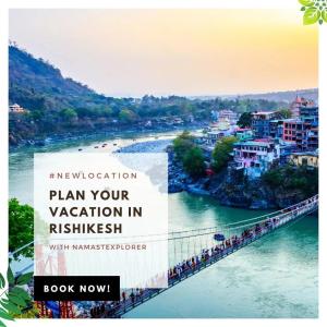 a bridge over a river with a group of people on it at Namastexplorer Rishikesh in Rishīkesh