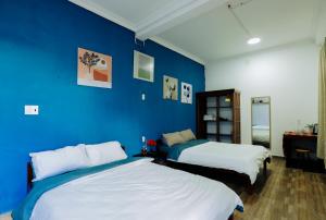 Giường trong phòng chung tại Be.Ho DaLat - Attic