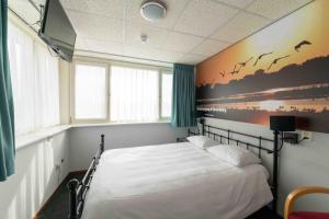 Postel nebo postele na pokoji v ubytování Hotel Hoogeerd by Flow Niftrik - Nijmegen