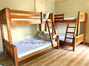 Postel nebo postele na pokoji v ubytování Hana Natsu Resorts Beach & Hotel