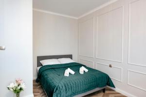 Ένα ή περισσότερα κρεβάτια σε δωμάτιο στο Wilcza 3g - 260m od Ambasady USA, 1km od Dworca Centralnego