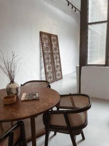 a dining room with a table and two chairs at Heritage Boutique Home in George Town
