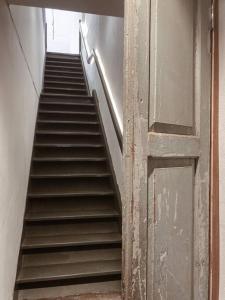 an empty staircase in an empty room with a door at Heritage Boutique Home in George Town