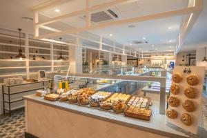 a bakery with a lot of different types of bread at Gran Hotel Flamingo-Adults Only older 18 years old in Lloret de Mar