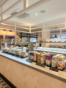 a kitchen with a counter with food on it at Gran Hotel Flamingo-Adults Only older 18 years old in Lloret de Mar