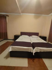Voodi või voodid majutusasutuse Home Hotel toas