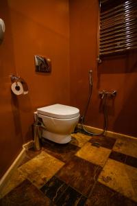 a bathroom with a toilet and a shower at Piazza Boutique Hotel in Batumi