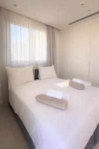 Postel nebo postele na pokoji v ubytování City Napa Seaview Villas - Villa 8