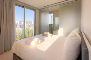 Postel nebo postele na pokoji v ubytování City Napa Seaview Villas - Villa 8
