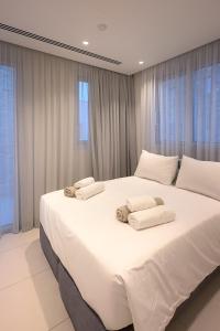 Postel nebo postele na pokoji v ubytování City Napa Seaview Villas - Villa 8