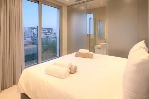 Postel nebo postele na pokoji v ubytování City Napa Seaview Villas - Villa 8