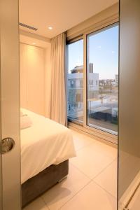 Postel nebo postele na pokoji v ubytování City Napa Seaview Villas - Villa 8