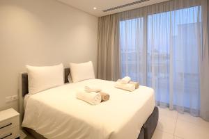Postel nebo postele na pokoji v ubytování City Napa Seaview Villas - Villa 8