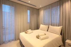 Postel nebo postele na pokoji v ubytování City Napa Seaview Villas - Villa 8