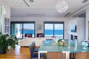 a living room with a table and a couch at Villa Pasiphae in Stalos