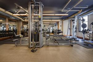 a gym with several treadmills and machines at Foggy Bottom 1BR w Gym Pool DM nr World Bank WDC-163 in Washington, D.C.