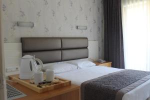 Кровать или кровати в номере Ida Hotel