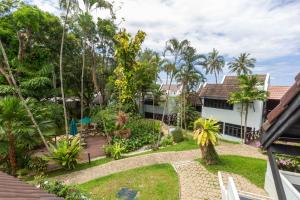 an exterior view of a house with a garden at Tropical Escape: Kamala Beach in Kamala Beach