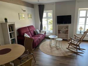 Televisyen dan/atau pusat hiburan di Wohnung Utkiek - Alte Schule