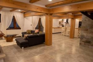 a living room with a couch and a kitchen at Walthaus in Vulcan