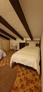 Lova arba lovos apgyvendinimo įstaigoje Casa Villa Josefina Piscina Privada 3 habitaciones