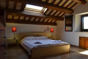 Postel nebo postele na pokoji v ubytování Agriturismo Forestale Luti + 37 fotografií