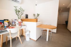 a small kitchen with a table and two chairs at Gest in Mellieħa