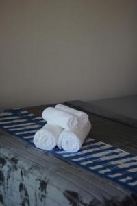 a stack of towels sitting on top of a table at Smile Resort Koh Mook in Ko Mook