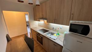 A kitchen or kitchenette at 3 room Apartment, free parking, Liptovský Mikuláš