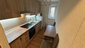 A kitchen or kitchenette at 3 room Apartment, free parking, Liptovský Mikuláš