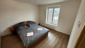 A bed or beds in a room at 3 room Apartment, free parking, Liptovský Mikuláš