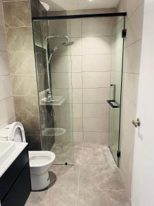 a bathroom with a shower and a toilet at AXON APARTMENT RESIDENTIAL SUITE in Kuala Lumpur