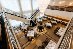 an overhead view of a restaurant with tables and chairs at Dinamo Hotel Baku in Baku