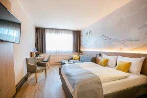 Krevet ili kreveti u jedinici u okviru objekta JUFA Hotel Weiz