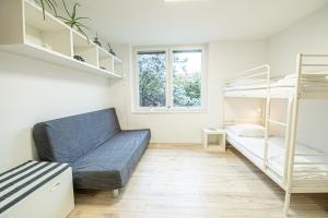 a living room with a couch and bunk beds at Umag center apartment parking by Rentistra in Umag