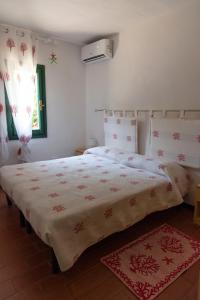Voodi või voodid majutusasutuse Residence Pinnetta Cala Bitta toas