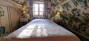 Posteľ alebo postele v izbe v ubytovaní Charmant logement dans un écrin de verdure