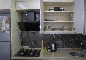 a kitchen with a stove and a counter top at Mar Suite in Istanbul