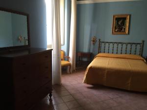La Casa di Mamma tesisinde bir odada yatak veya yataklar