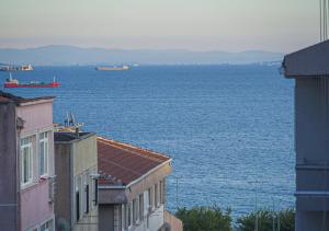 a view of the ocean from between two buildings at Mar Suite in Istanbul