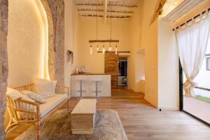 a living room with a couch and a table at Private Spa in Kangen House Jerez in Jerez de la Frontera