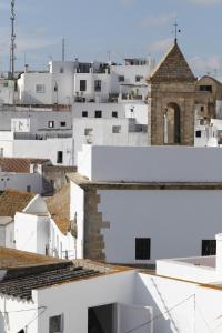a view of the roofs of white buildings at Apartamentos Casamonteymar Bas-Ser in Vejer de la Frontera