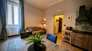 a living room with a table and a couch at Sea Lion in Trani