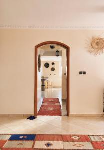 a hallway with an open door to a room at Ocean View Home in Mirleft