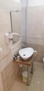 a bathroom with a sink and a mirror at Hotel Boccascena in Genoa