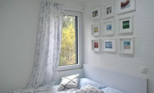 Postel nebo postele na pokoji v ubytování Hiona Apartment