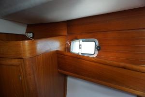 a small window in the back of a boat at Bed on board in Palermo